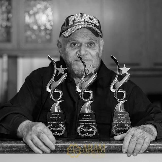 David Winters holding awards