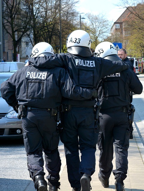 humans in police uniform