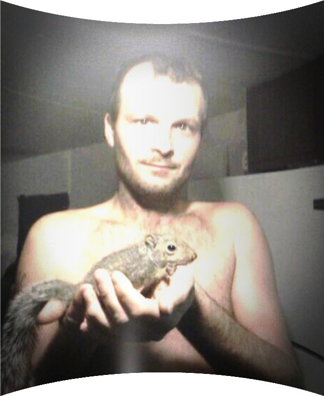 Nick Kampmann with a rescued squirrel